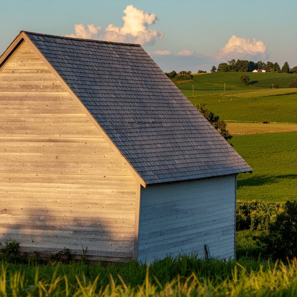 Metal‑roof hay barn with durable siding designed for long‑term hay storage and weather protection