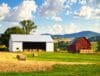 Pole barn and traditional barn side by side showing hay storage options
