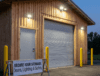 Secure storage building with strong doors, bright exterior lighting, and safety features for safe access and protection.