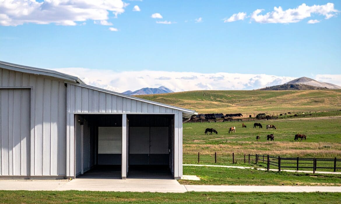 Spacious horse barn layout with large stalls, wide aisles, and room for future expansion