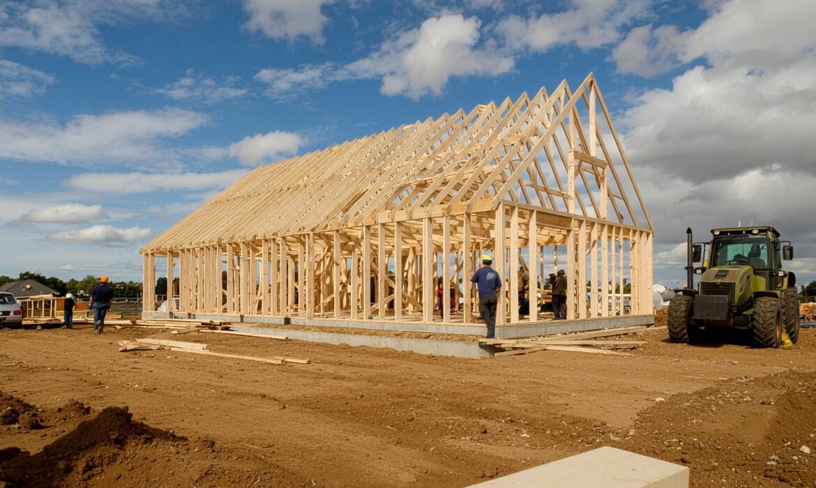 Post‑frame home build process showing planning, site prep, construction, and finishing steps